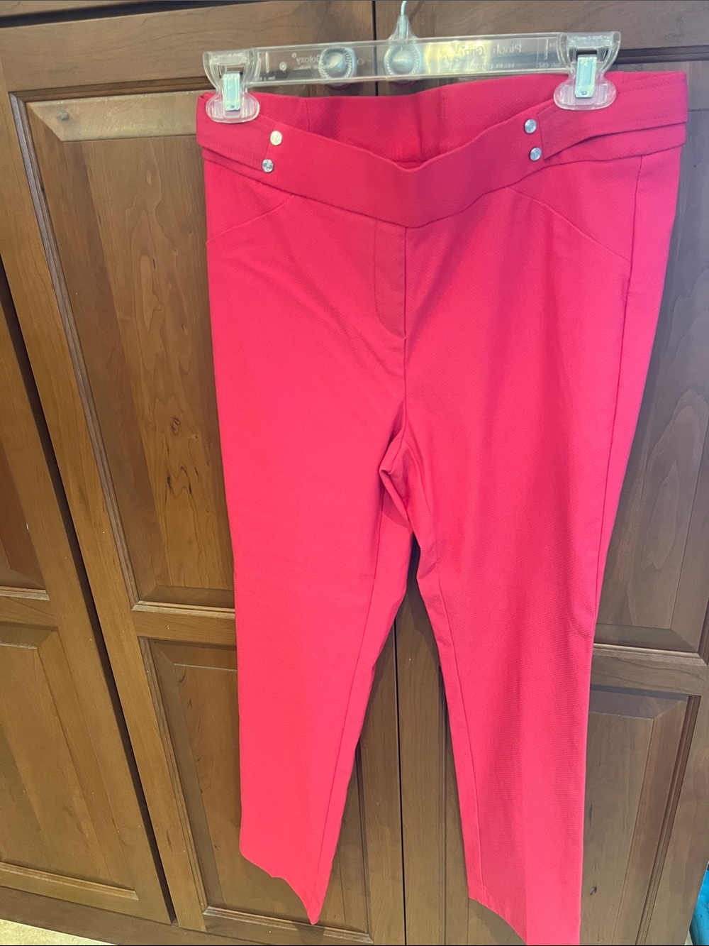 Pair of coral Rafaella slim pants